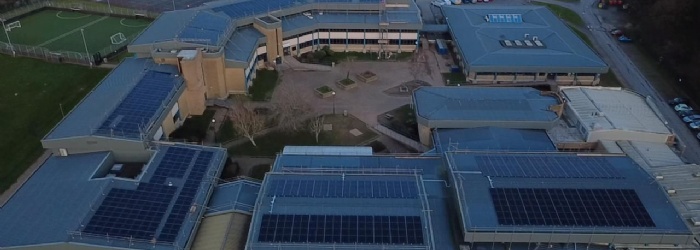 Image of Lipson building showing all the solar pannels on the roof. 